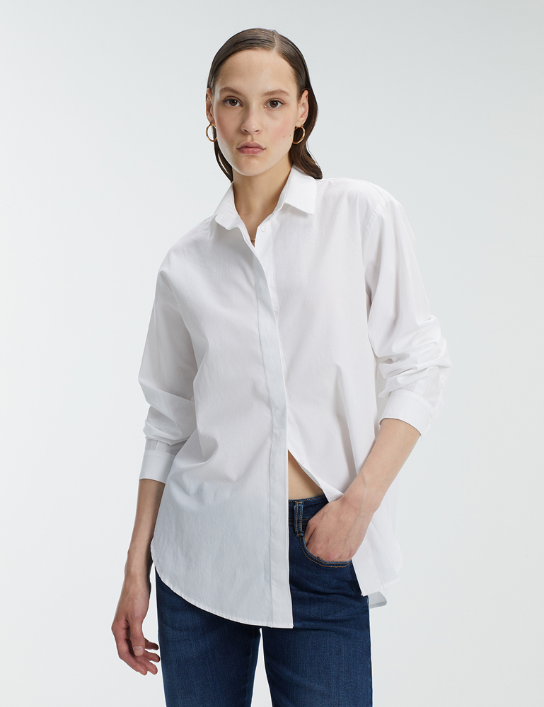 Camisa blanca con botones ocultos Andam colección joven gus gus boutique, moda de calle de la mejores marcas. Confeccionado en España.